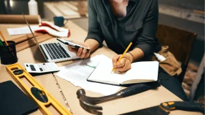 A person working in a hybrid workshop and office space.